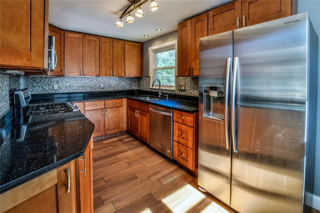 220 Fox Chapel Road Pittsburgh, PA 15238 - Photo 5 of 14 The newly updated kitchen offers beautiful new cabinetry, granite countertops and stainless appliances.