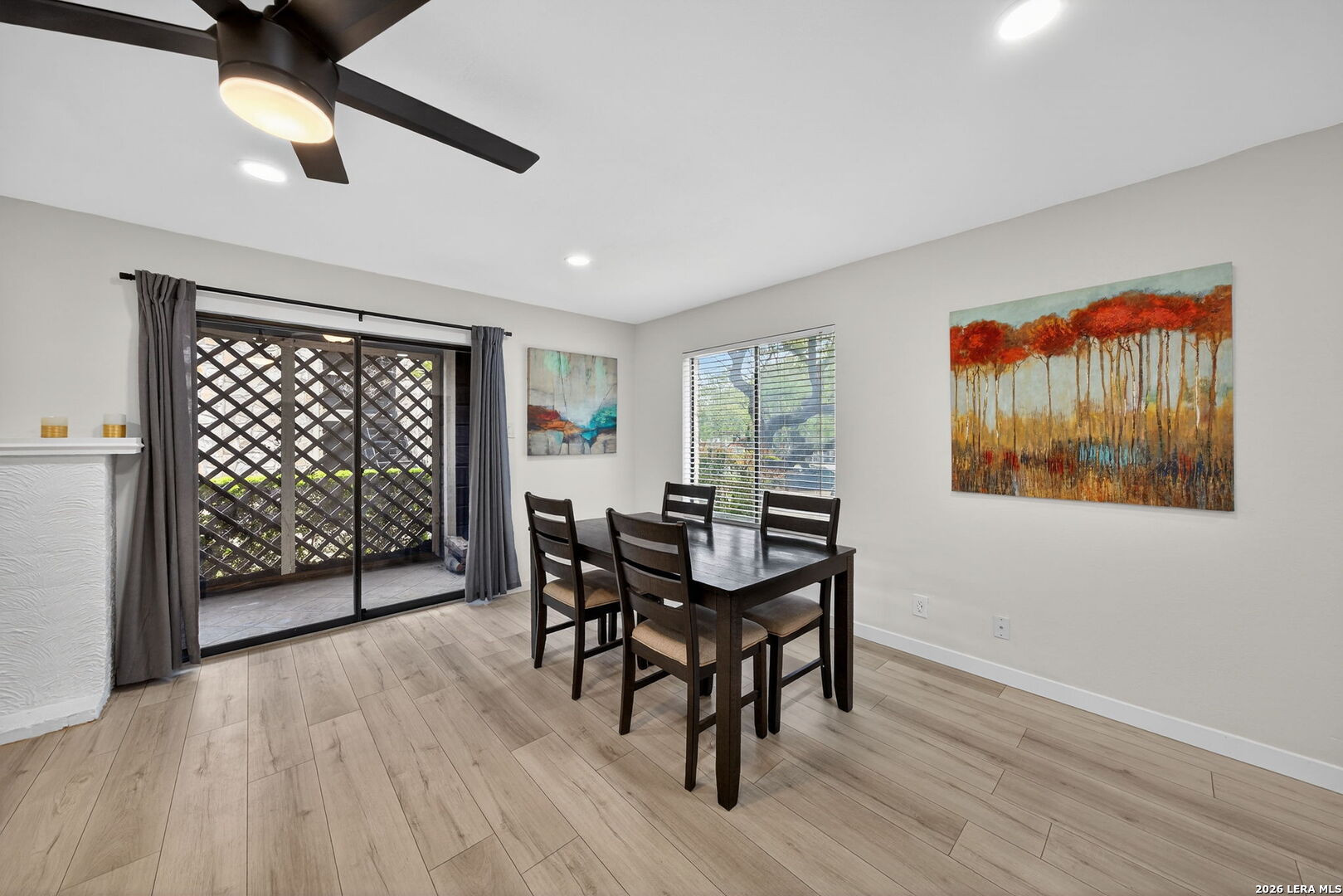 11520 Huebner Road, Unit 501 San Antonio, TX 78230 - Photo 12 of 27 a view of a dining room with furniture window and wooden floor