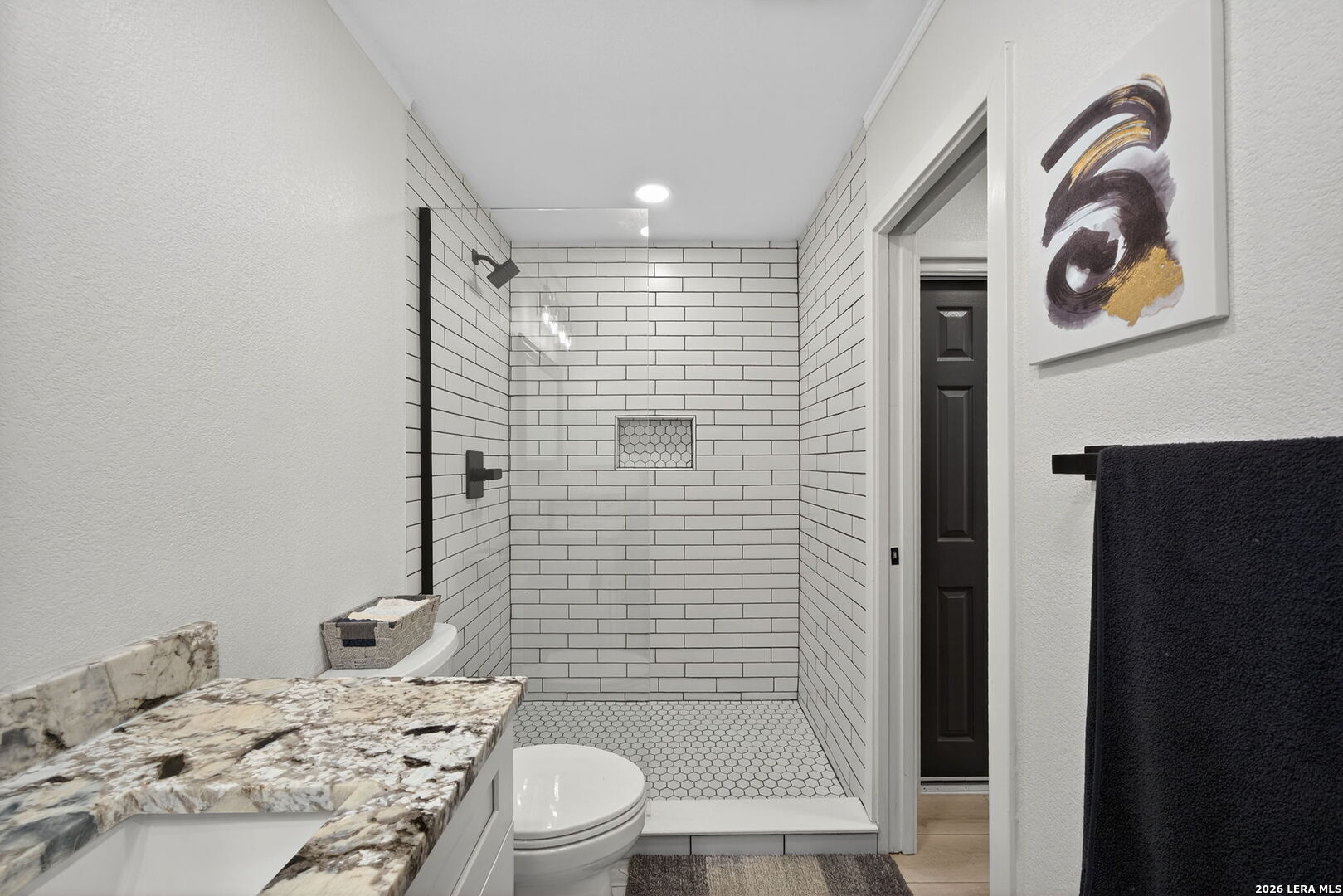 11520 Huebner Road, Unit 501 San Antonio, TX 78230 - Photo 22 of 27 a bathroom with a sink a toilet and shower