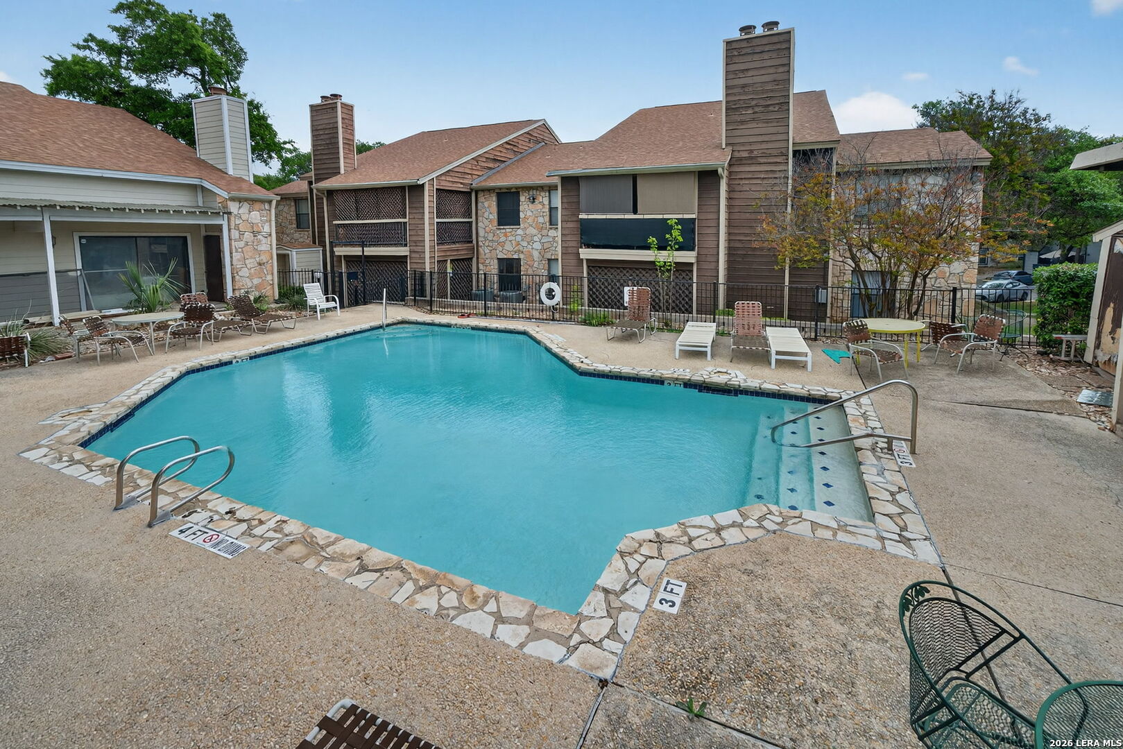 11520 Huebner Road, Unit 501 San Antonio, TX 78230 - Photo 7 of 27 a swimming pool with outdoor seating and yard
