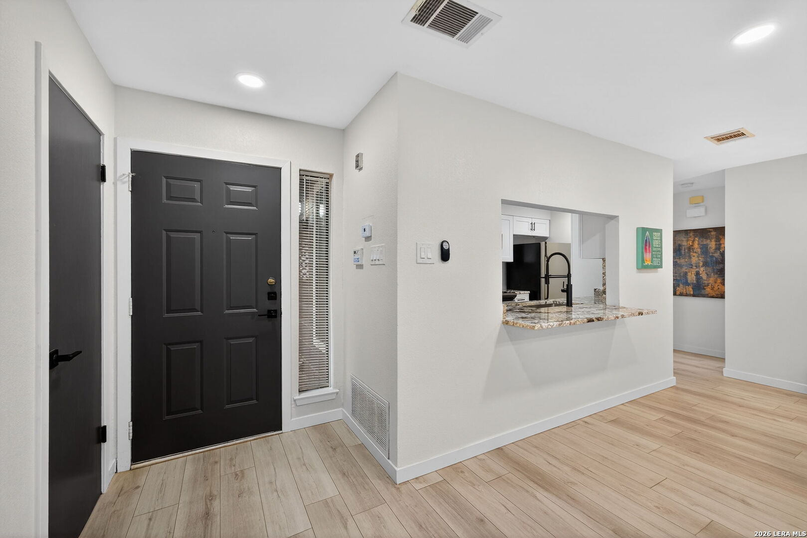11520 Huebner Road, Unit 501 San Antonio, TX 78230 - Photo 8 of 27 a view of a kitchen from the hallway