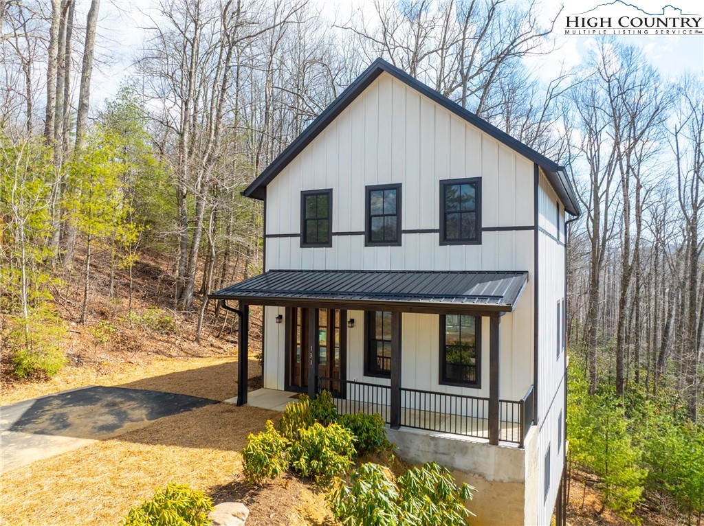 131 Bryce Way Boone, NC 28607 - Photo 28 of 38 a front view of a house with a yard