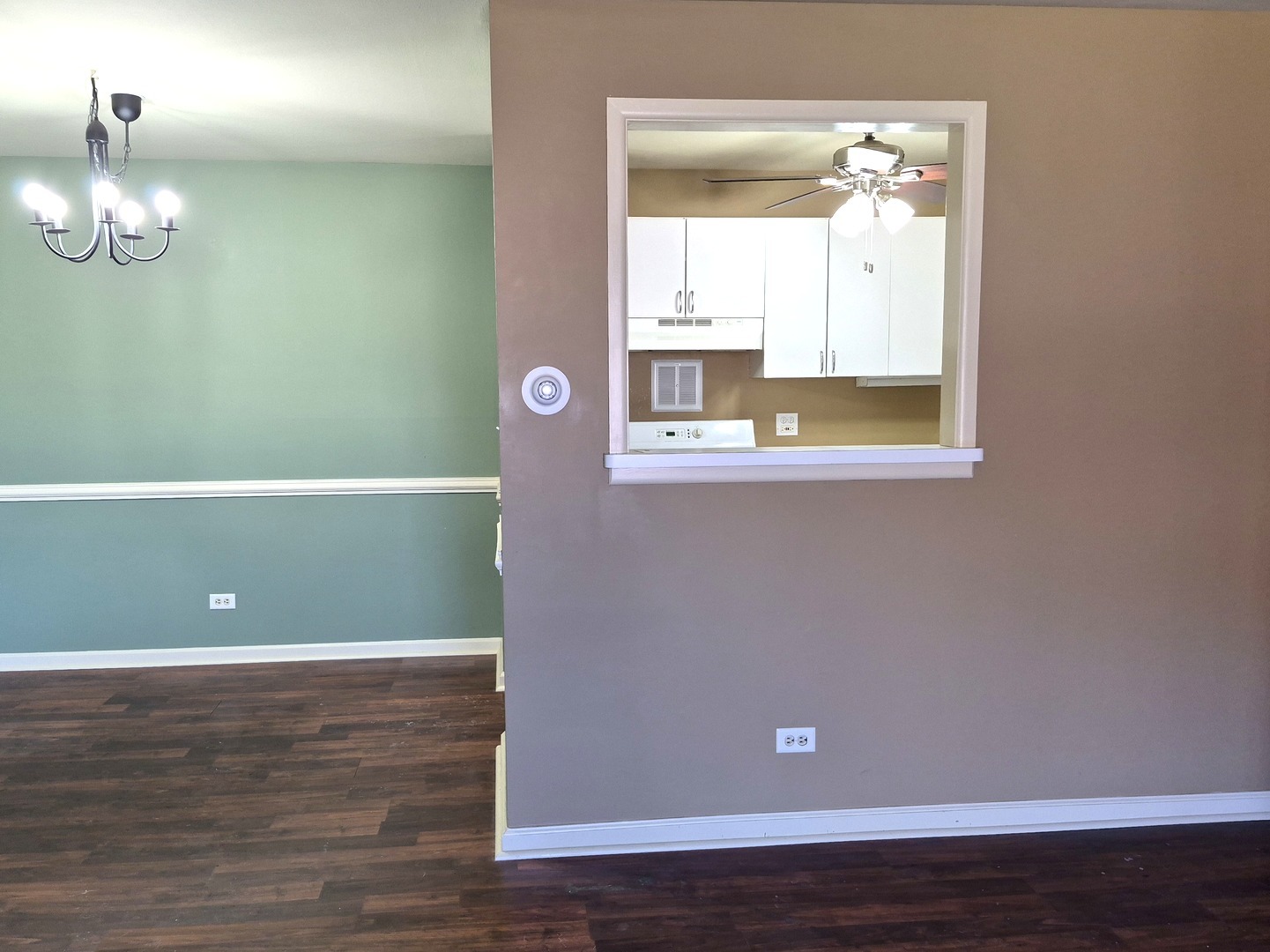 1117 South Old Wilke Road, Unit 206 Arlington Heights, IL 60005 - Photo 5 of 9 a view of a room with wooden floor and window