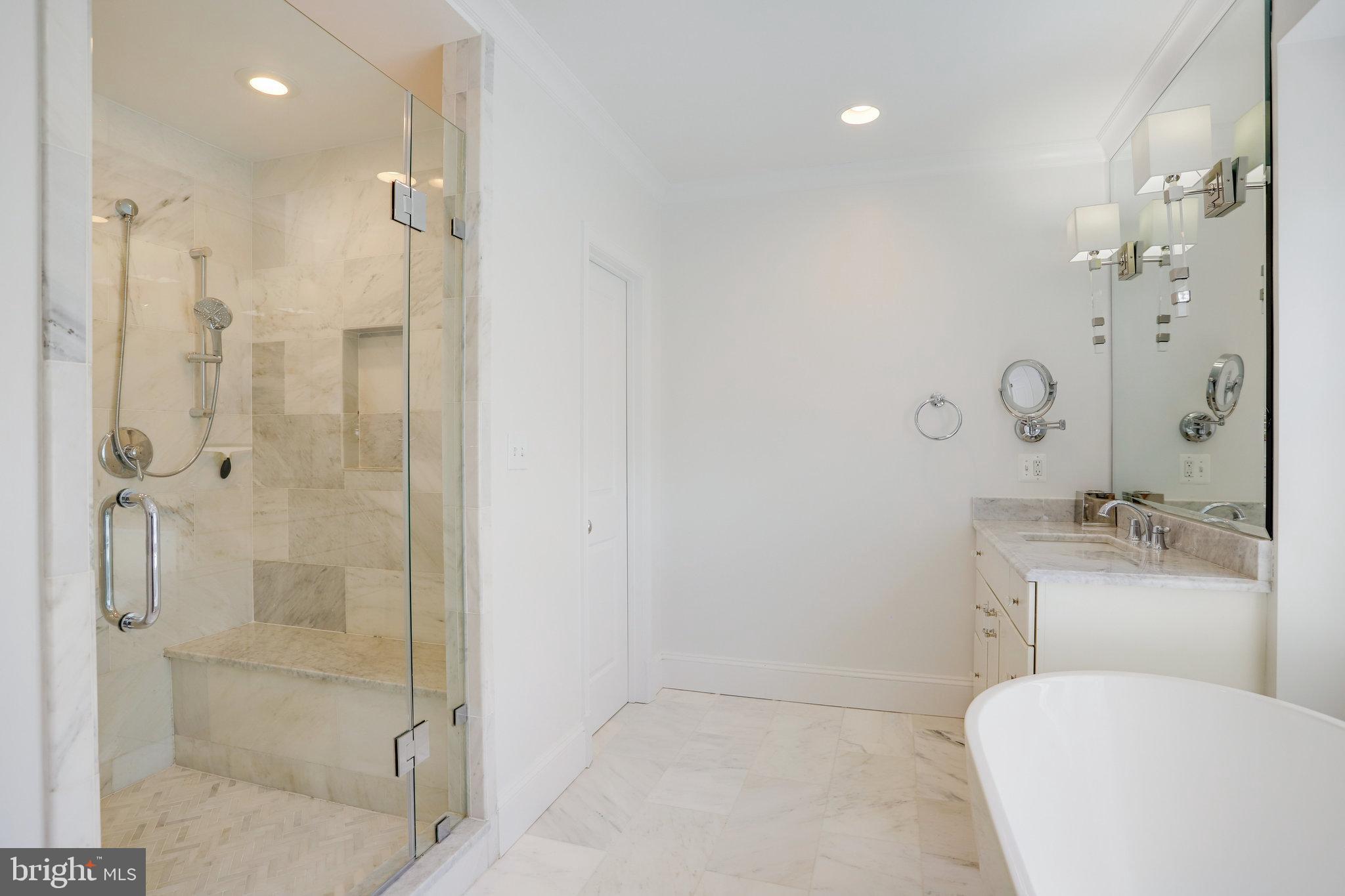 4548 Windsor Lane Bethesda, MD 20814 - Photo 13 of 39 a bathroom with a toilet sink and shower