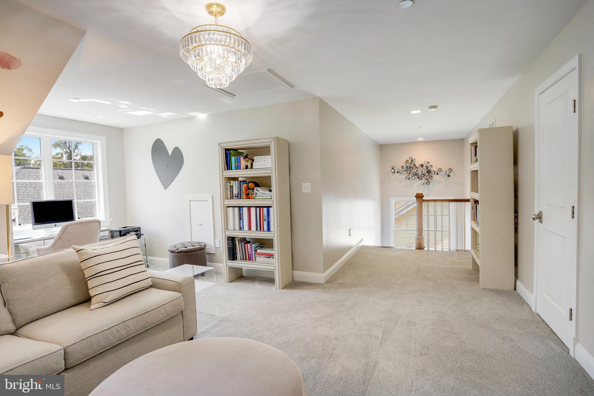 4548 Windsor Lane Bethesda, MD 20814 - Photo 22 of 39 a living room with furniture a rug and a window