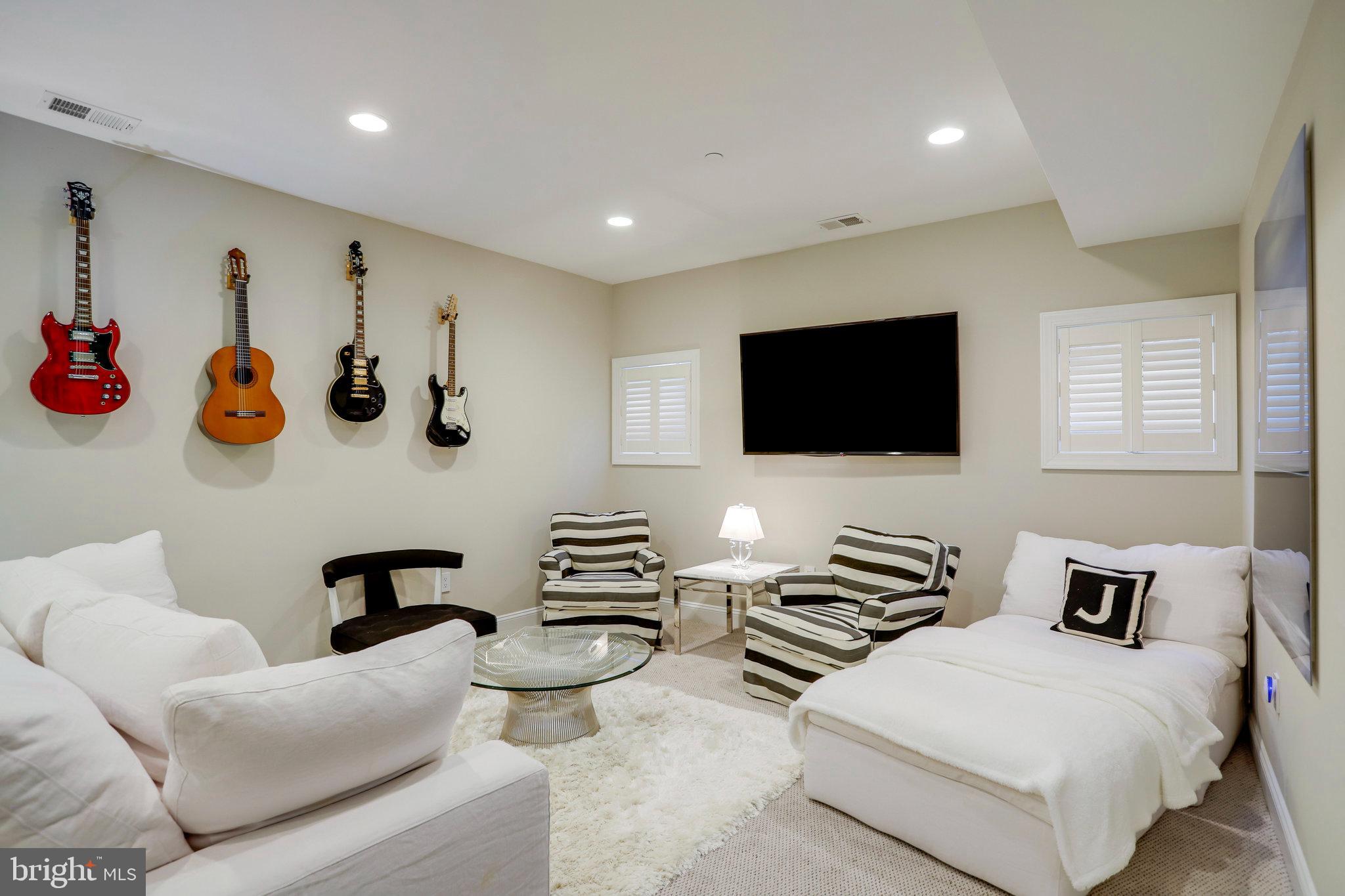 4548 Windsor Lane Bethesda, MD 20814 - Photo 23 of 39 a living room with furniture and a flat screen tv