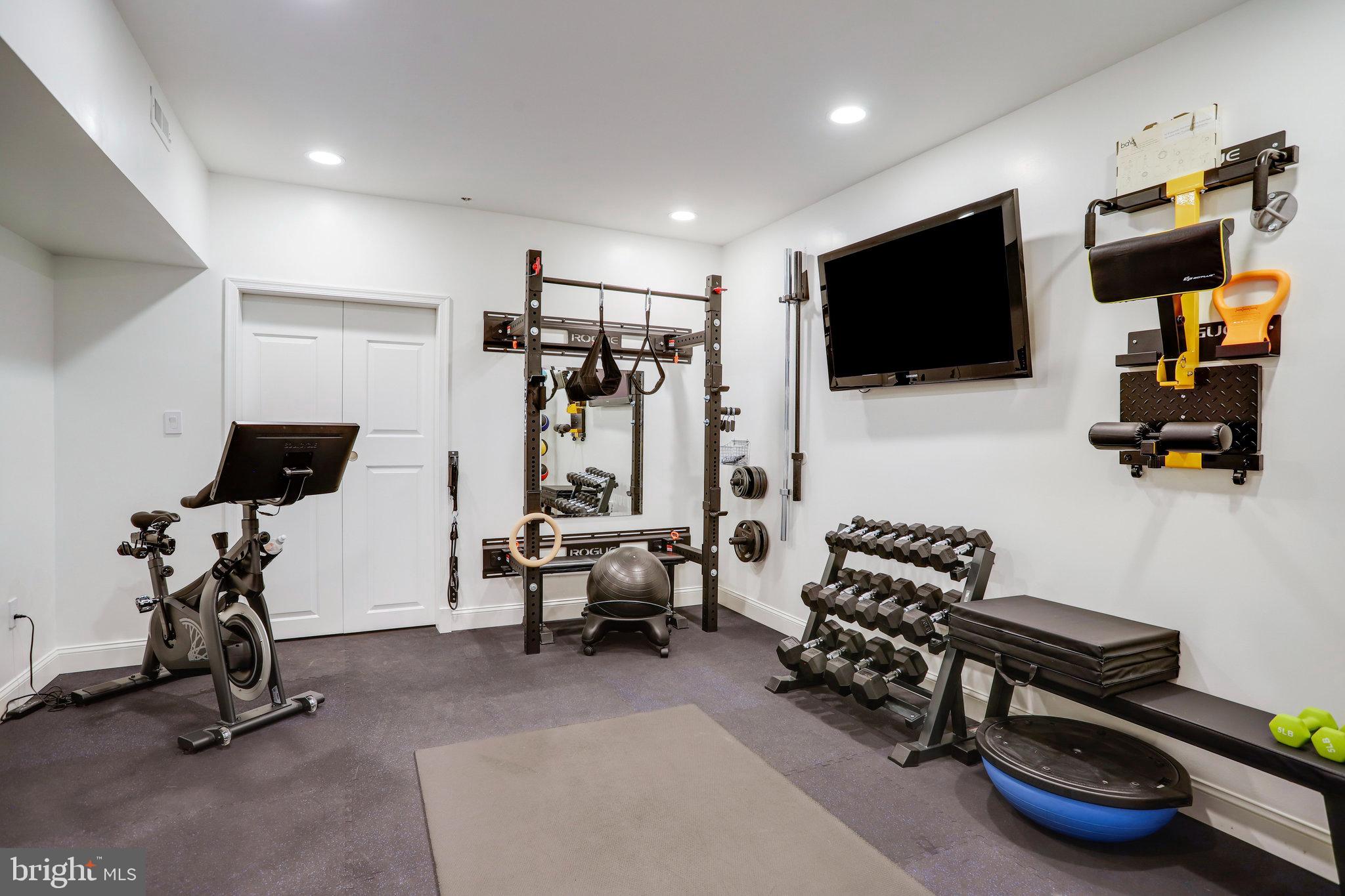 4548 Windsor Lane Bethesda, MD 20814 - Photo 25 of 39 a living room with furniture and a flat screen tv