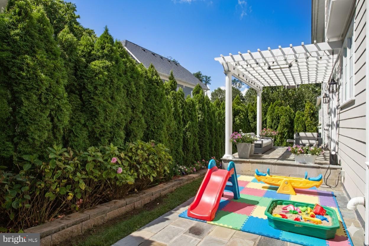 4548 Windsor Lane Bethesda, MD 20814 - Photo 32 of 39 a view of swimming pool with a patio