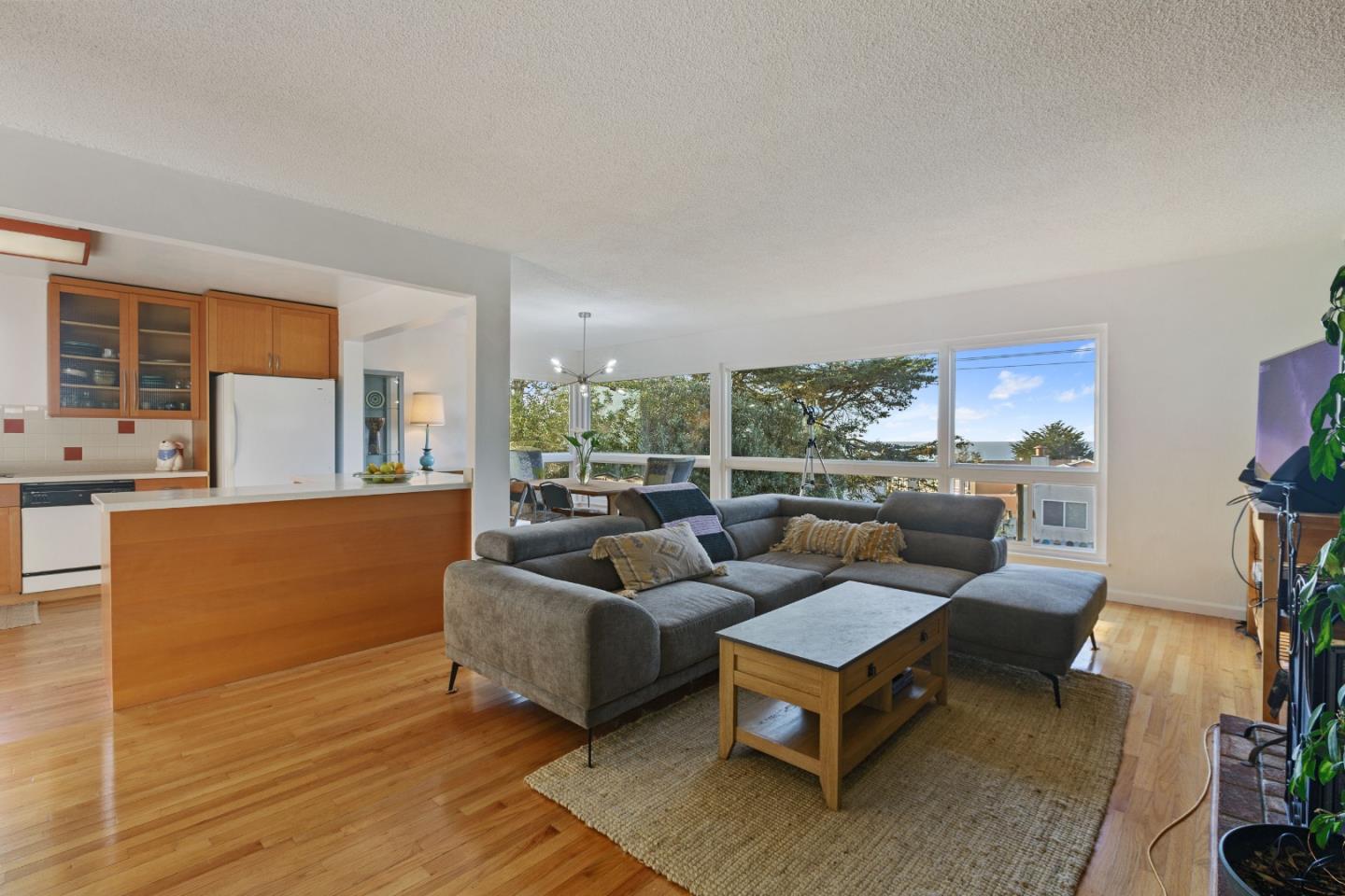 107 Crestmoor Circle Pacifica, CA 94044 - Photo 11 of 45 a living room with furniture and a large window