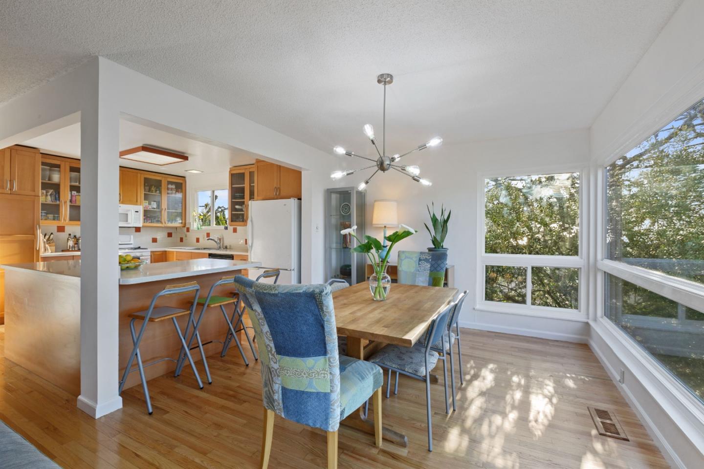 107 Crestmoor Circle Pacifica, CA 94044 - Photo 12 of 45 a view of a dining room with furniture window and wooden floor