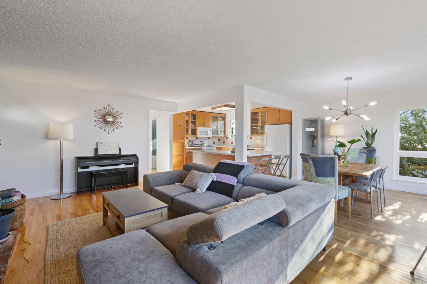 107 Crestmoor Circle Pacifica, CA 94044 - Photo 13 of 45 a living room with furniture and a fireplace