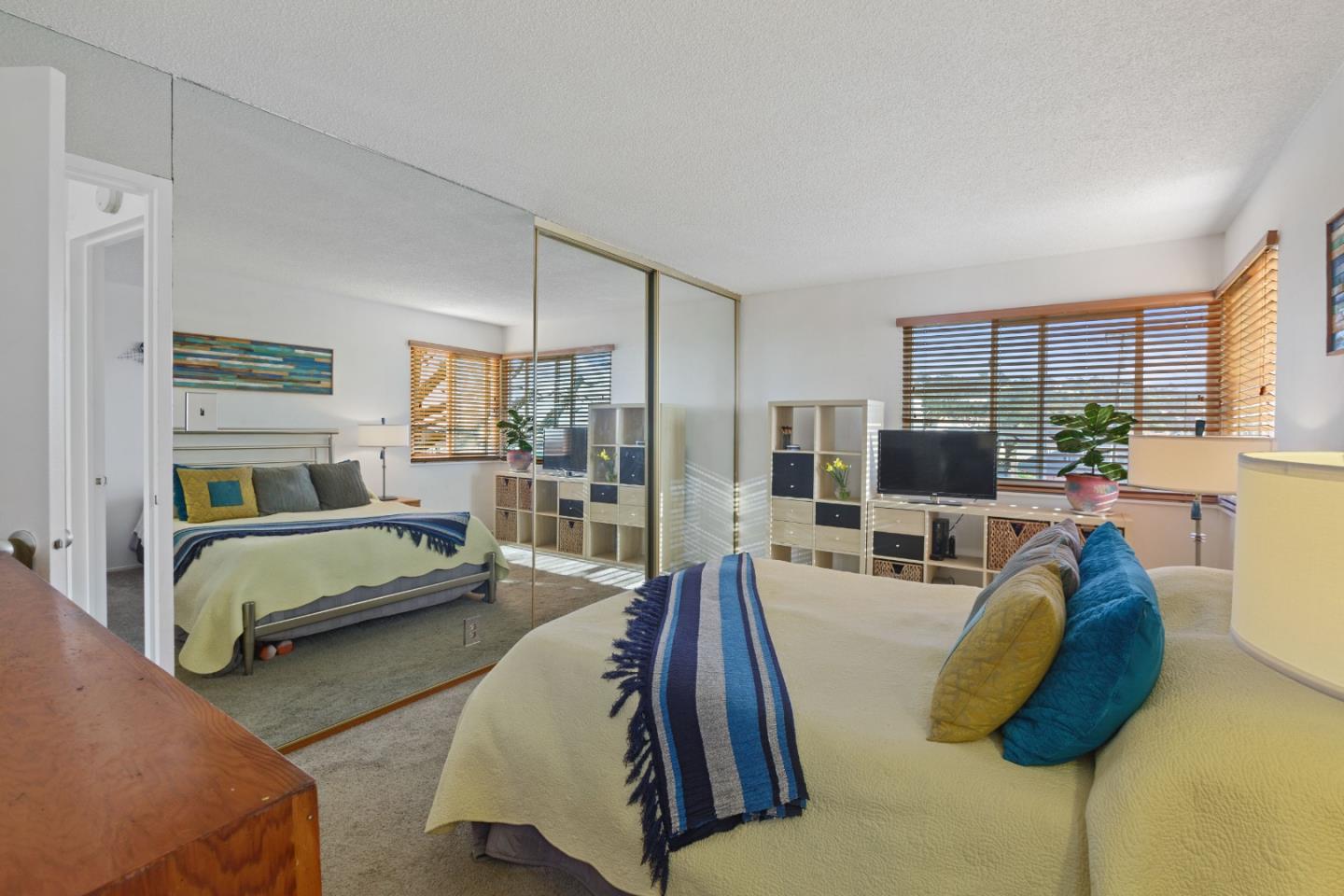 107 Crestmoor Circle Pacifica, CA 94044 - Photo 21 of 45 a bedroom with furniture and a flat screen tv