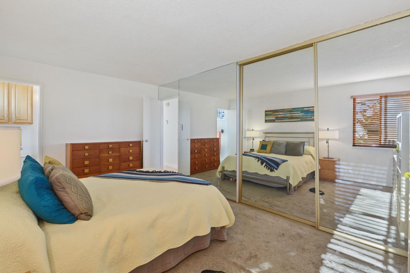 107 Crestmoor Circle Pacifica, CA 94044 - Photo 22 of 45 a bedroom with a bed and wooden floor