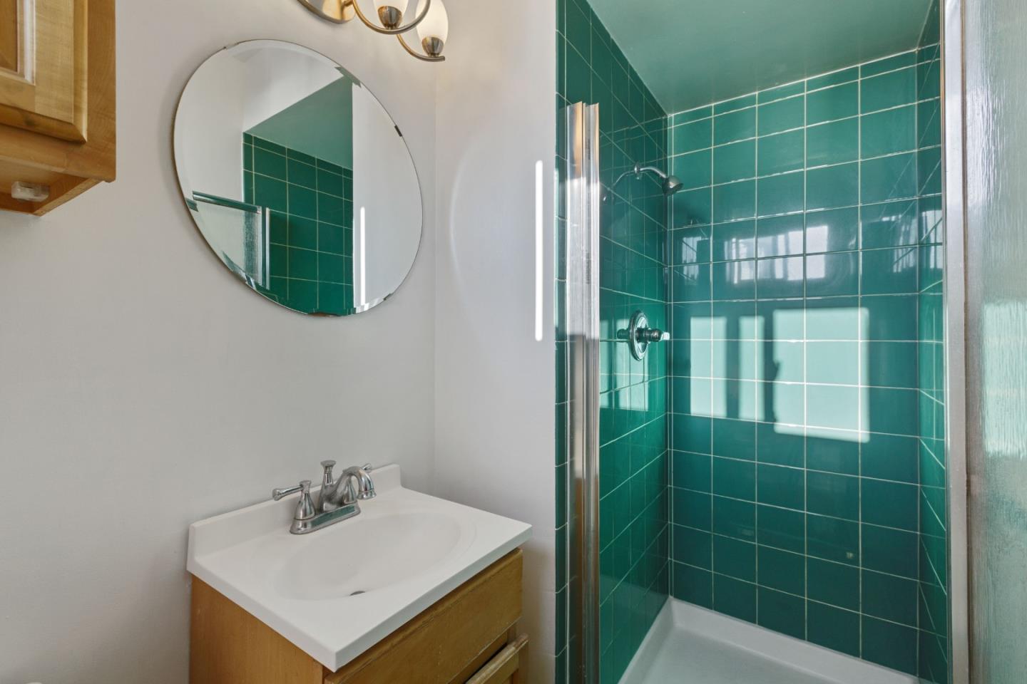 107 Crestmoor Circle Pacifica, CA 94044 - Photo 28 of 45 a bathroom with a sink mirror and tub