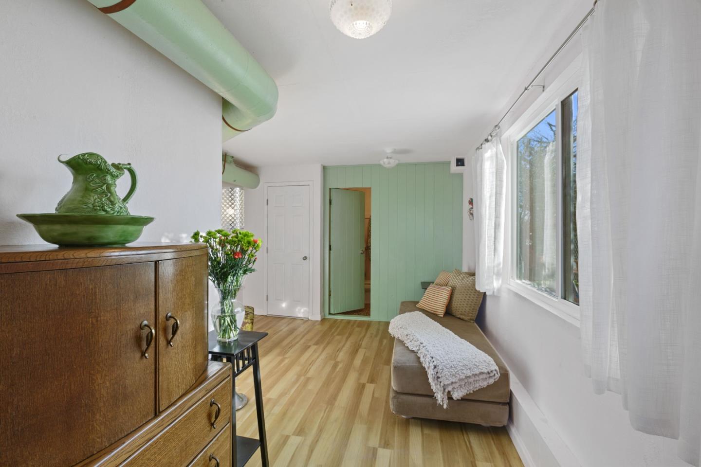 107 Crestmoor Circle Pacifica, CA 94044 - Photo 31 of 45 a bedroom with a bed and a potted plant