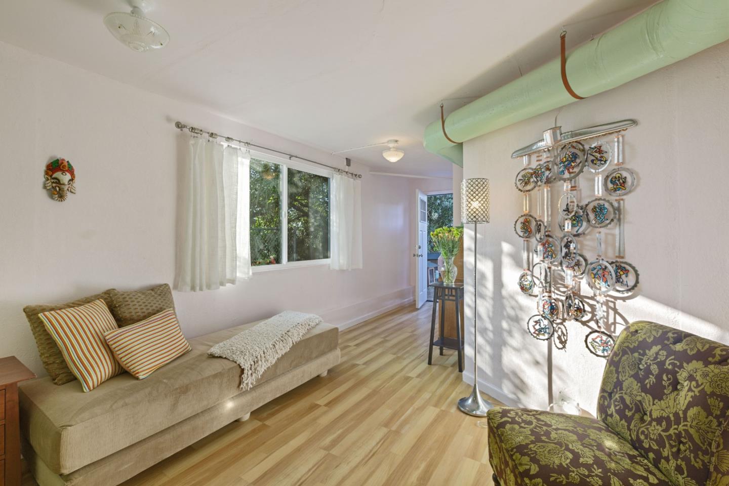 107 Crestmoor Circle Pacifica, CA 94044 - Photo 32 of 45 a living room with furniture and a large window