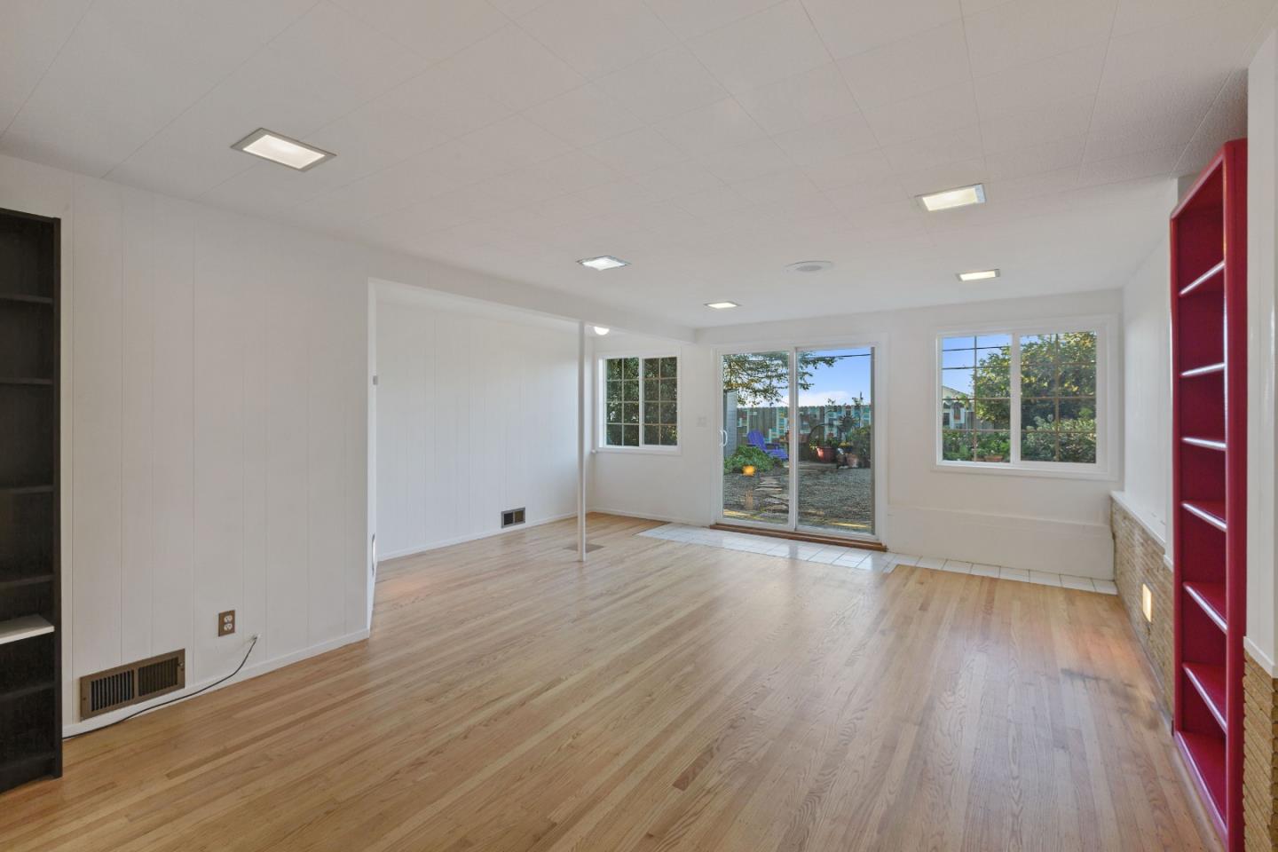 107 Crestmoor Circle Pacifica, CA 94044 - Photo 33 of 45 a view of an empty room with wooden floor and a window