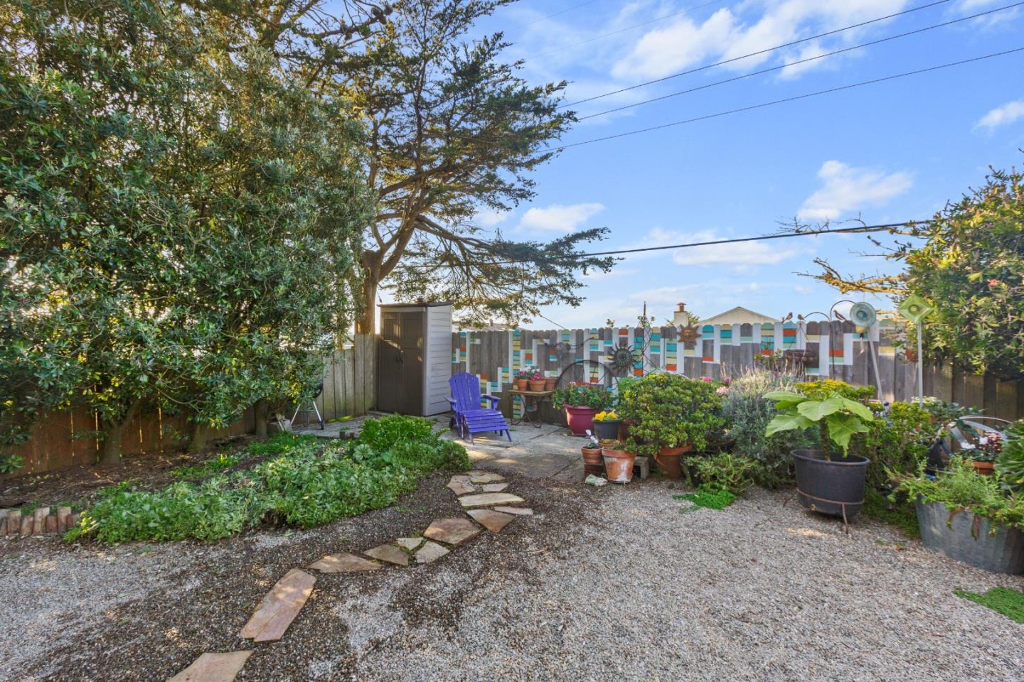 107 Crestmoor Circle Pacifica, CA 94044 - Photo 38 of 45 a view of a garden with a bench in patio