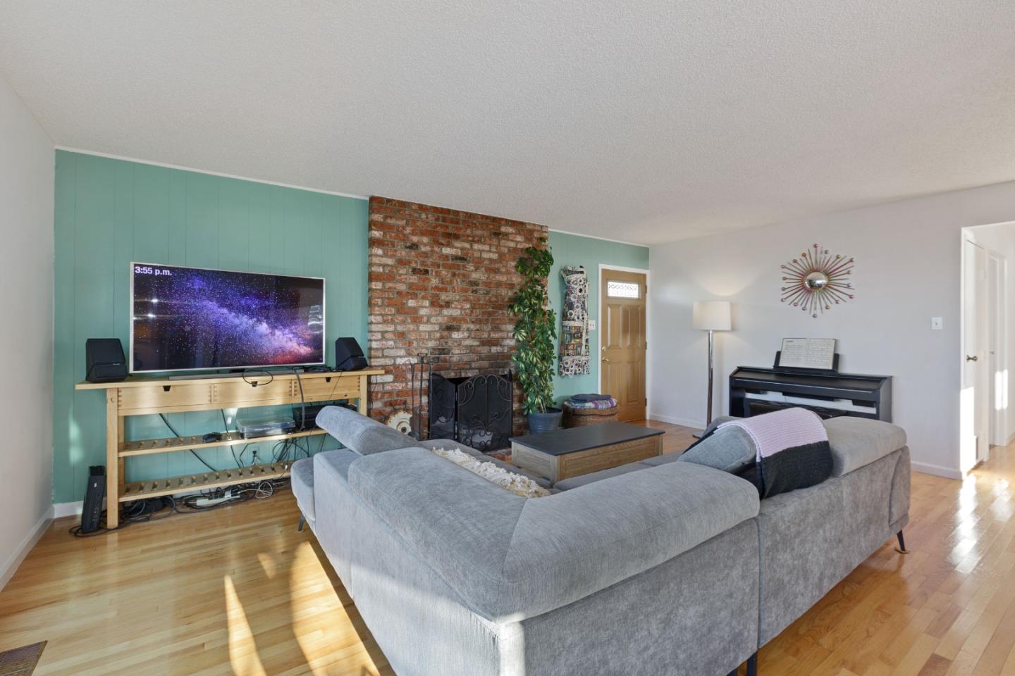 107 Crestmoor Circle Pacifica, CA 94044 - Photo 5 of 45 a living room with furniture and a fireplace