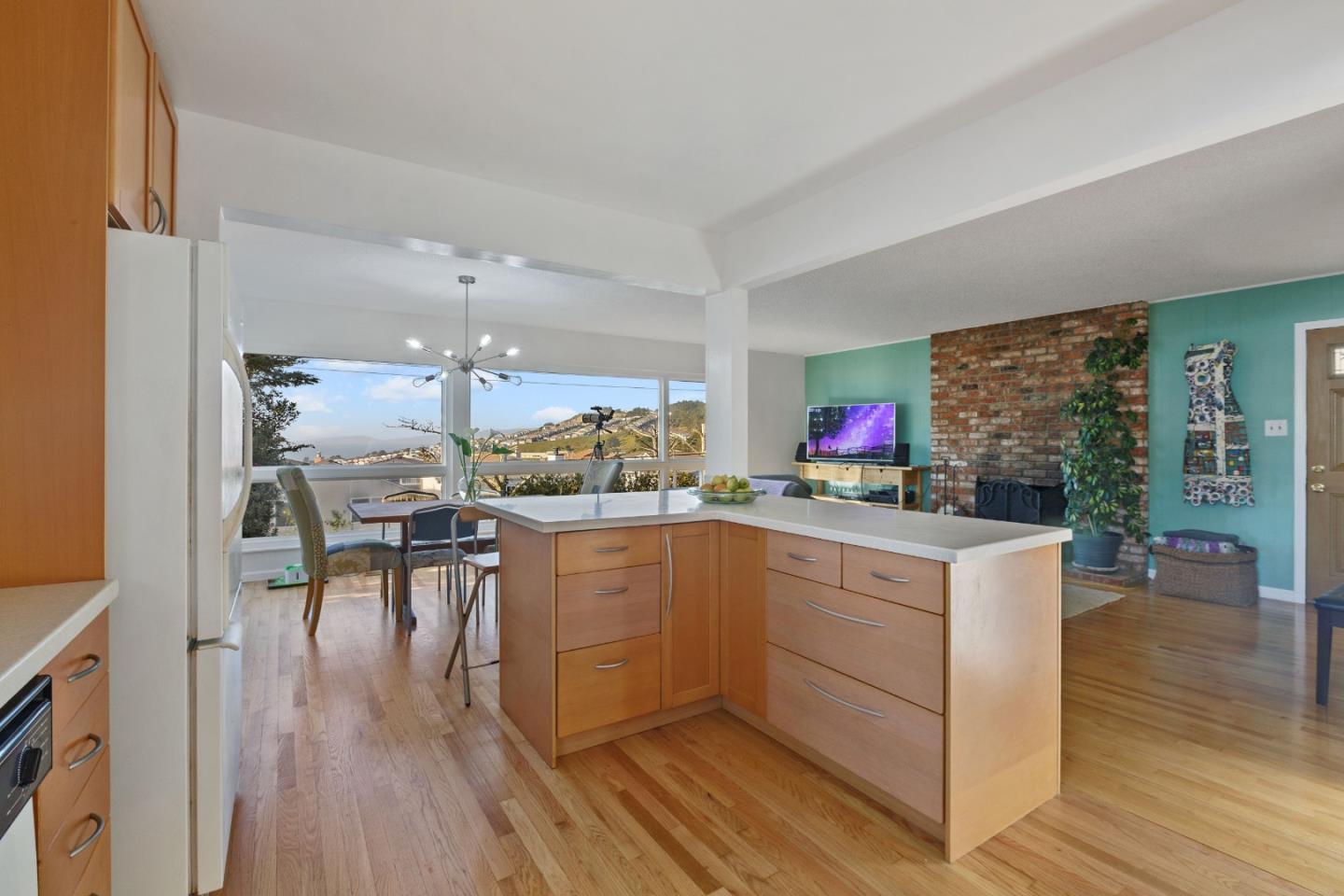 107 Crestmoor Circle Pacifica, CA 94044 - Photo 7 of 45 a kitchen with a sink cabinets and wooden floor