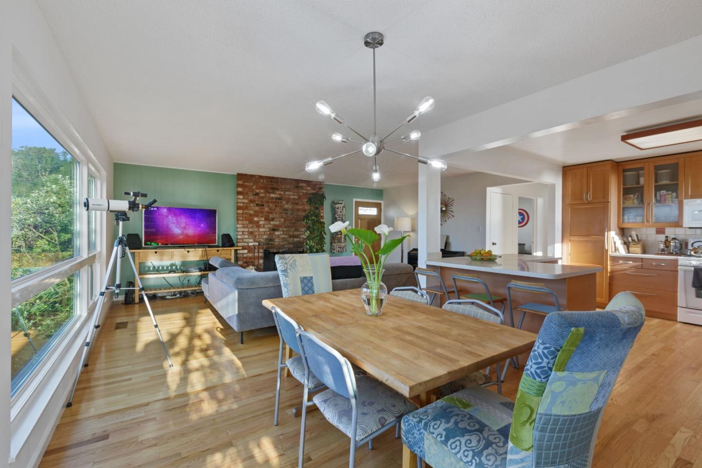107 Crestmoor Circle Pacifica, CA 94044 - Photo 8 of 45 a view of a dining room with furniture a rug and wooden floor