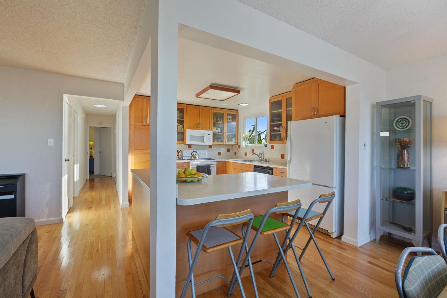 107 Crestmoor Circle Pacifica, CA 94044 - Photo 10 of 45 a dining room with furniture and wooden floor