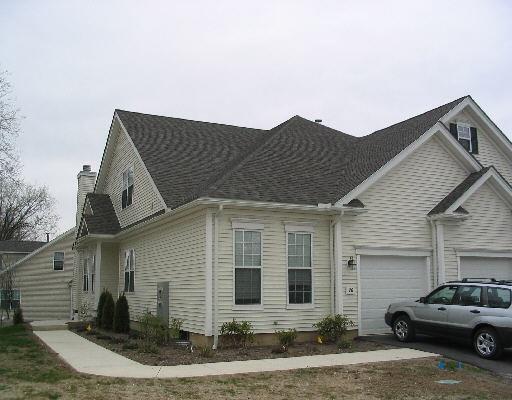 a view of a car park in front of house