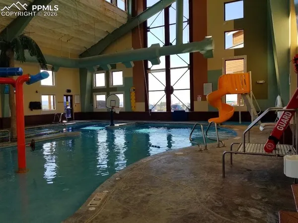 a view of pool with outdoor seating