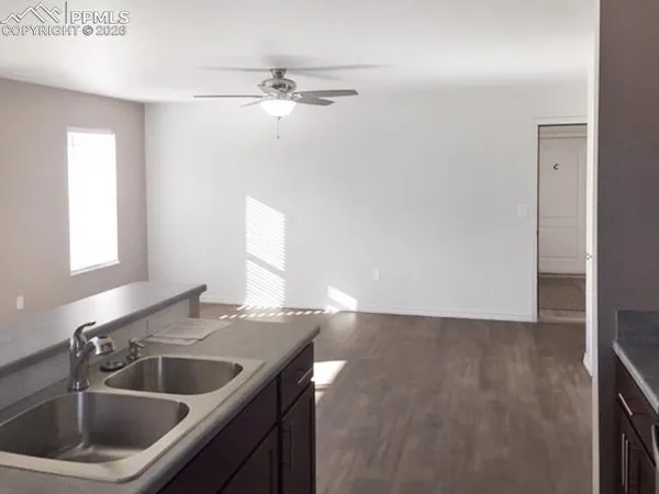 a kitchen with a sink and chandelier