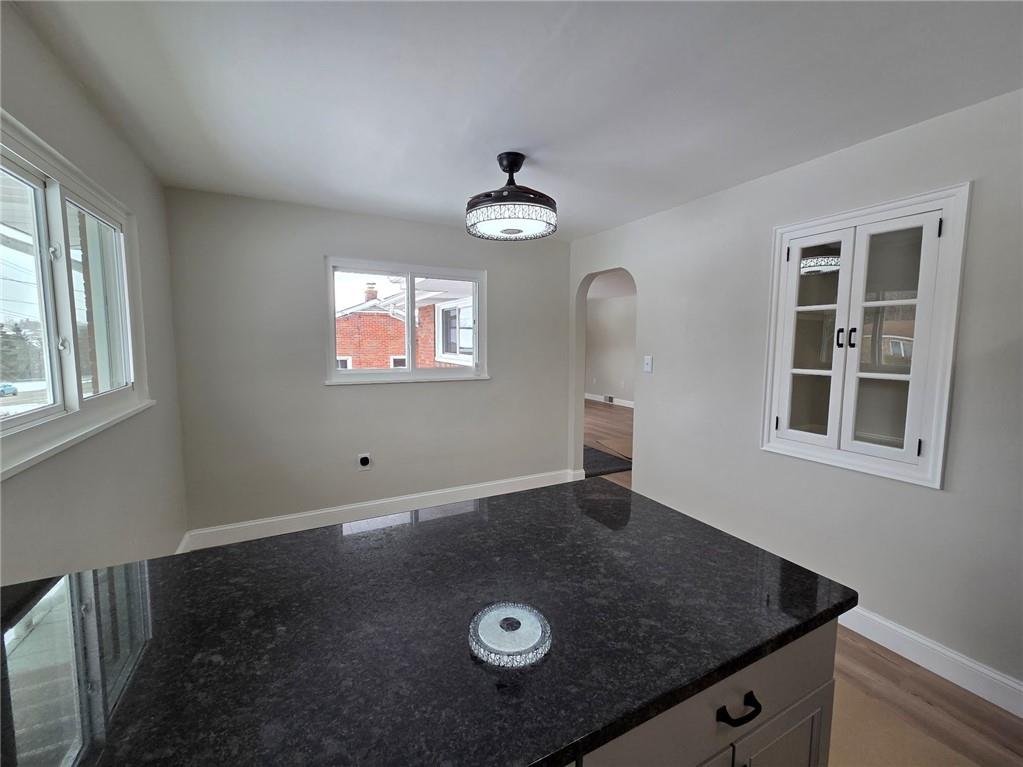265 North Duffy Road Butler, PA 16001 - Photo 11 of 41 an empty room with wooden floor cabinet and windows