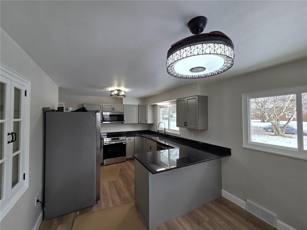 265 North Duffy Road Butler, PA 16001 - Photo 13 of 41 a kitchen with a refrigerator and a sink