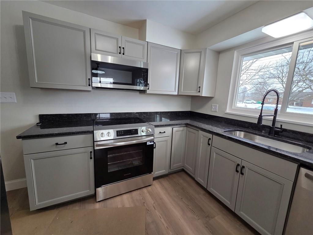 265 North Duffy Road Butler, PA 16001 - Photo 15 of 41 a kitchen with granite countertop white cabinets and appliances