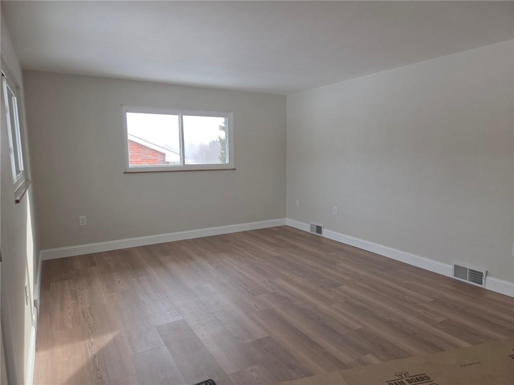 265 North Duffy Road Butler, PA 16001 - Photo 17 of 41 an empty room with wooden floor and windows