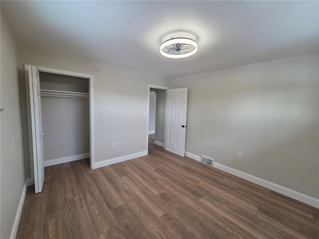 265 North Duffy Road Butler, PA 16001 - Photo 20 of 41 a view of an empty room with wooden floor & closet
