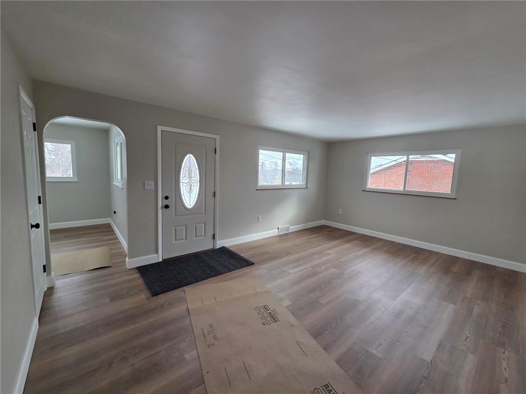 265 North Duffy Road Butler, PA 16001 - Photo 5 of 41 an empty room with wooden floor and mirror