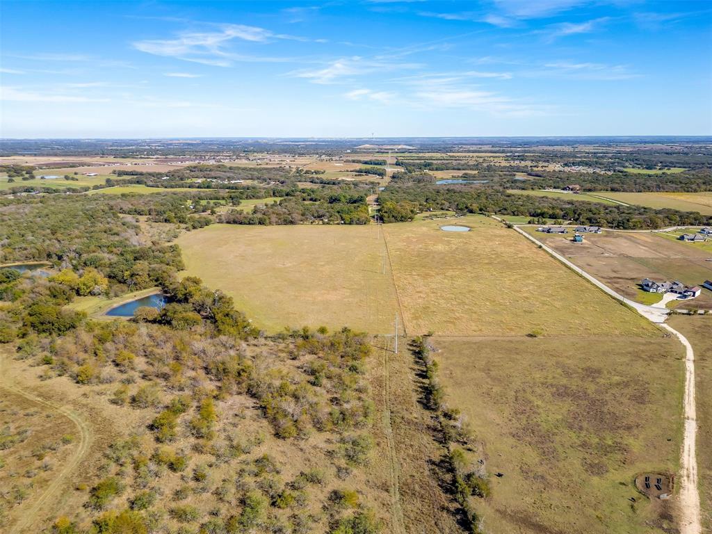 0 County Road 410 Road Alvarado, TX 76009 - Photo 7 of 12 Expansive acreage featuring multiple open fields, wooded areas, and two ponds