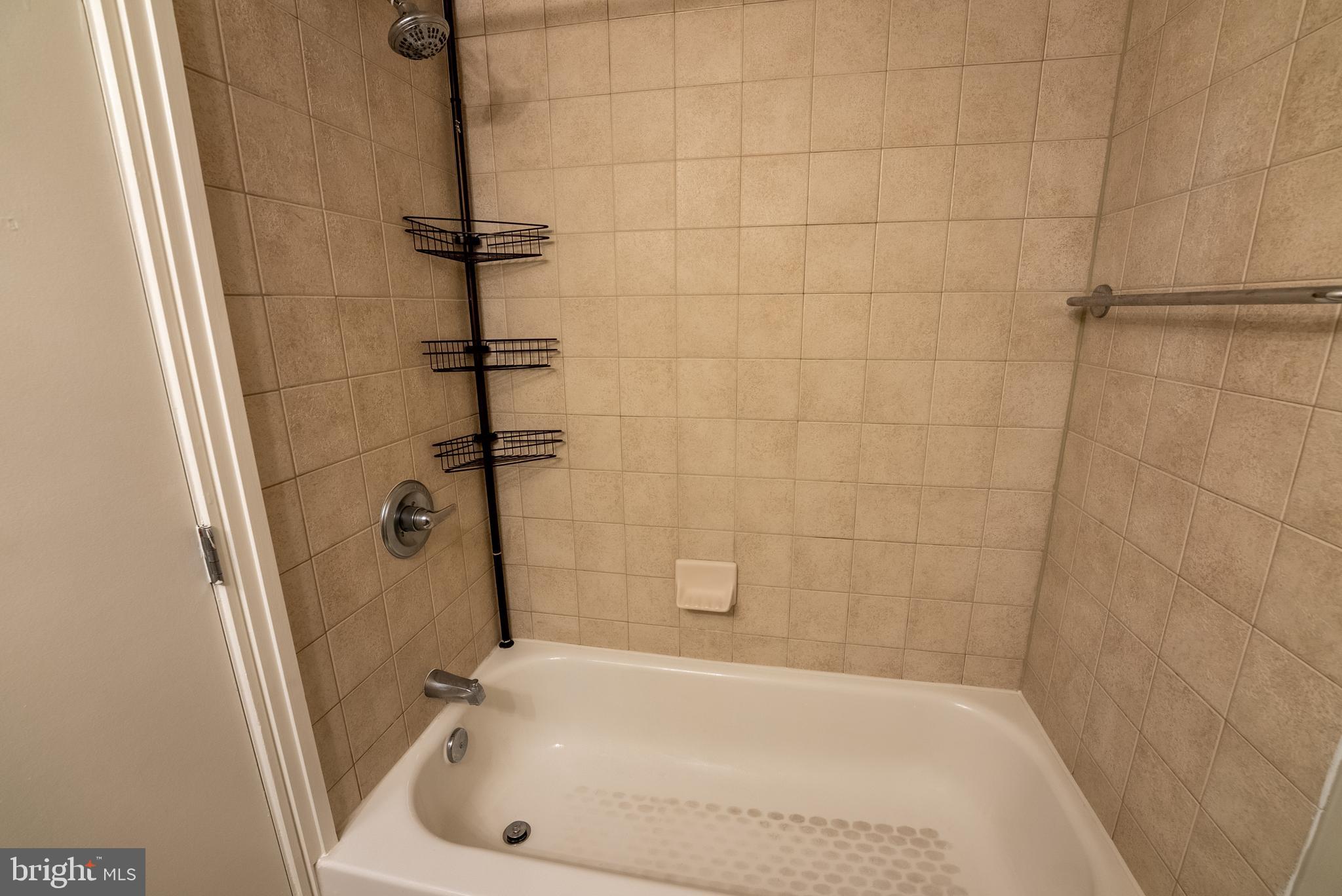 800 4th Street Southwest, Unit N312 Washington, DC 20024 - Photo 12 of 16 a bathroom with a bathtub