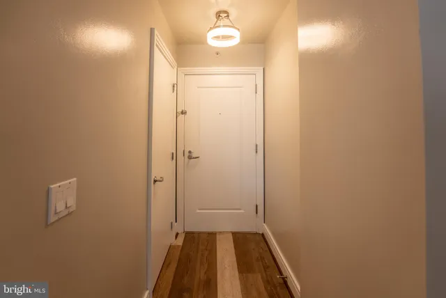 a dining room with furniture a large window and plants