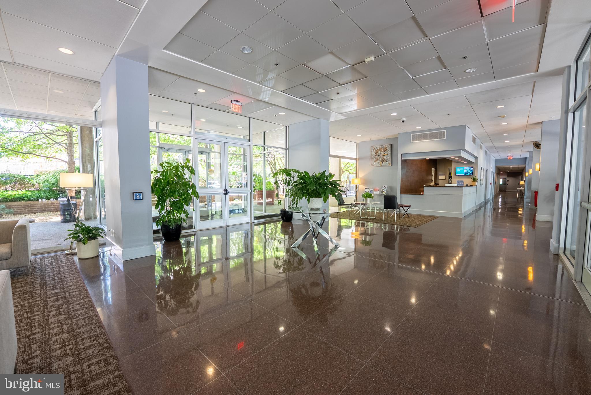 800 4th Street Southwest, Unit N312 Washington, DC 20024 - Photo 15 of 16 a dining room with furniture a large window and plants