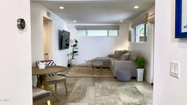 a view of a chairs and table in a room
