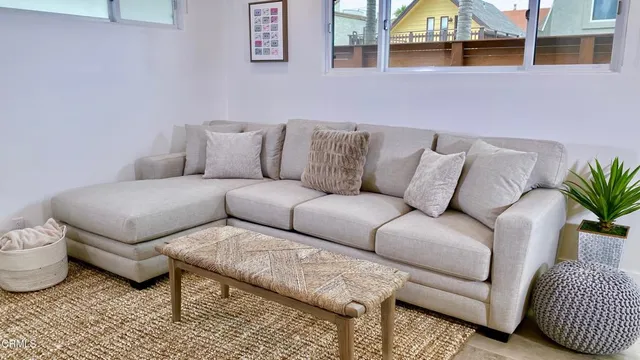 a view of a livingroom with furniture and wooden floor