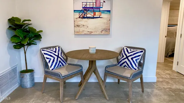 a room with furniture and white walls