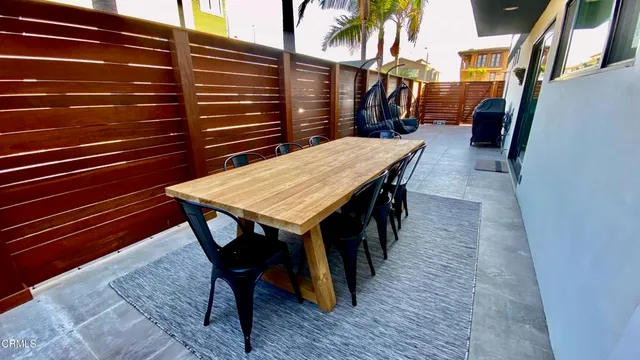 a bedroom with a bed and a curtain