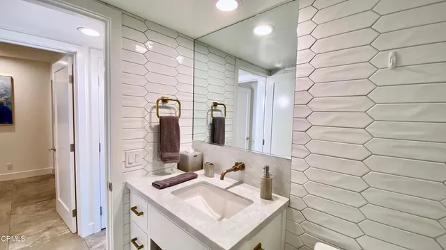 a living room with furniture a fireplace and a table