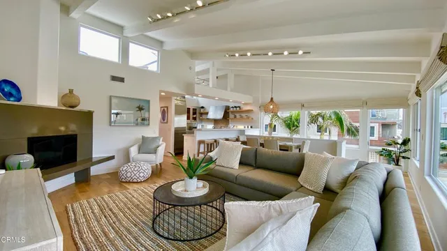 a kitchen with stainless steel appliances a stove a sink and a wooden cabinets