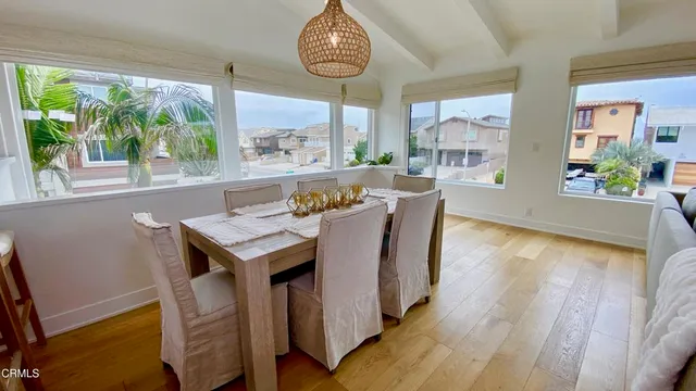 a kitchen with stainless steel appliances granite countertop a refrigerator a stove and a sink with cabinets