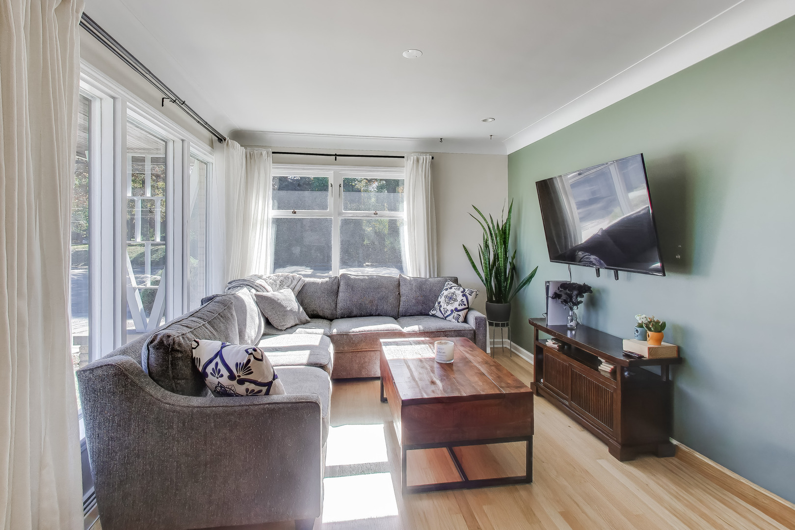 Undisclosed Address Chicago, IL 60655 - Photo 11 of 25 a living room with furniture and a flat screen tv