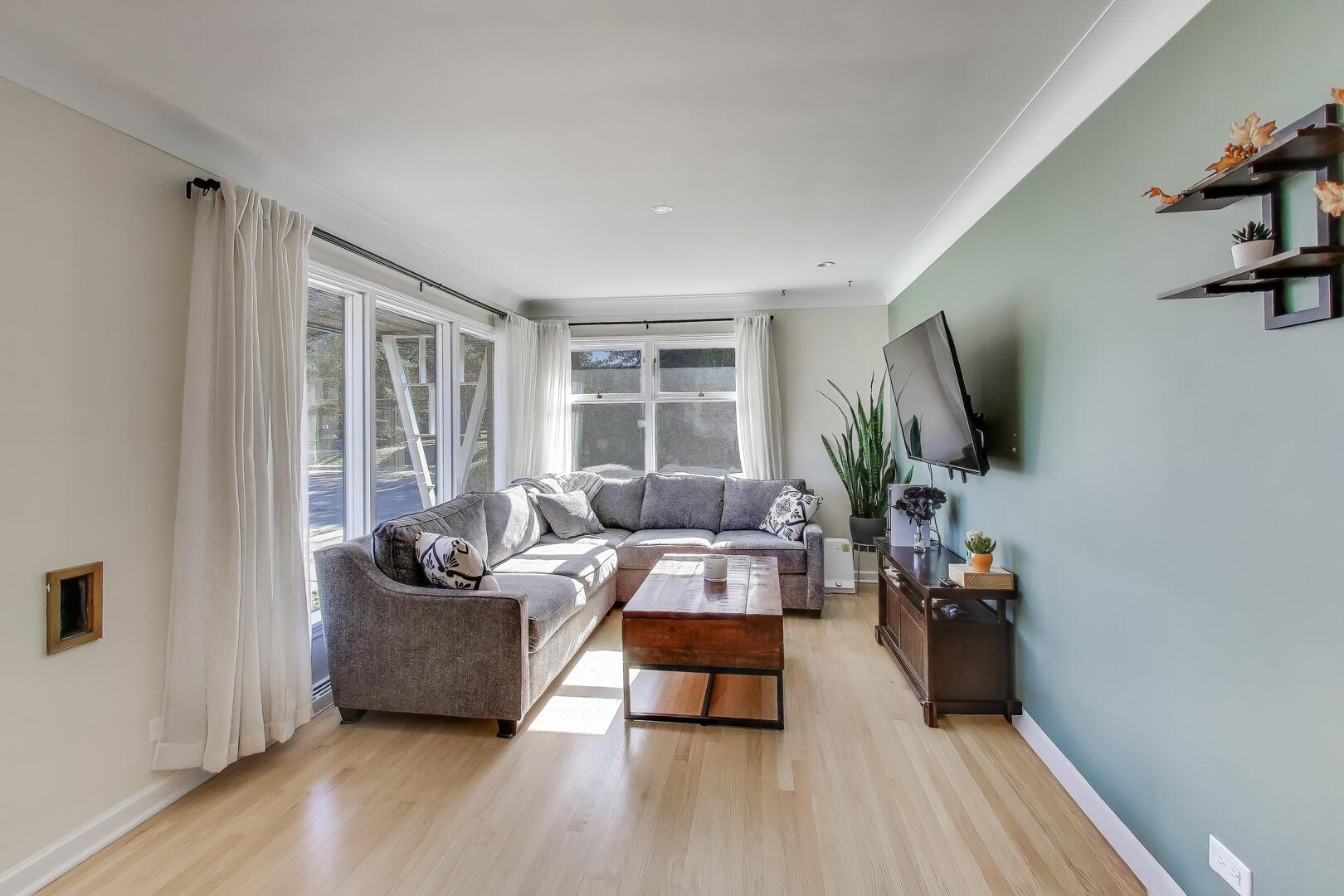 Undisclosed Address Chicago, IL 60655 - Photo 12 of 25 a living room with furniture and a flat screen tv