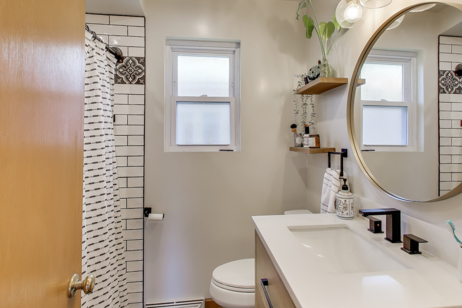 Undisclosed Address Chicago, IL 60655 - Photo 15 of 25 a bathroom with a sink a toilet and shower