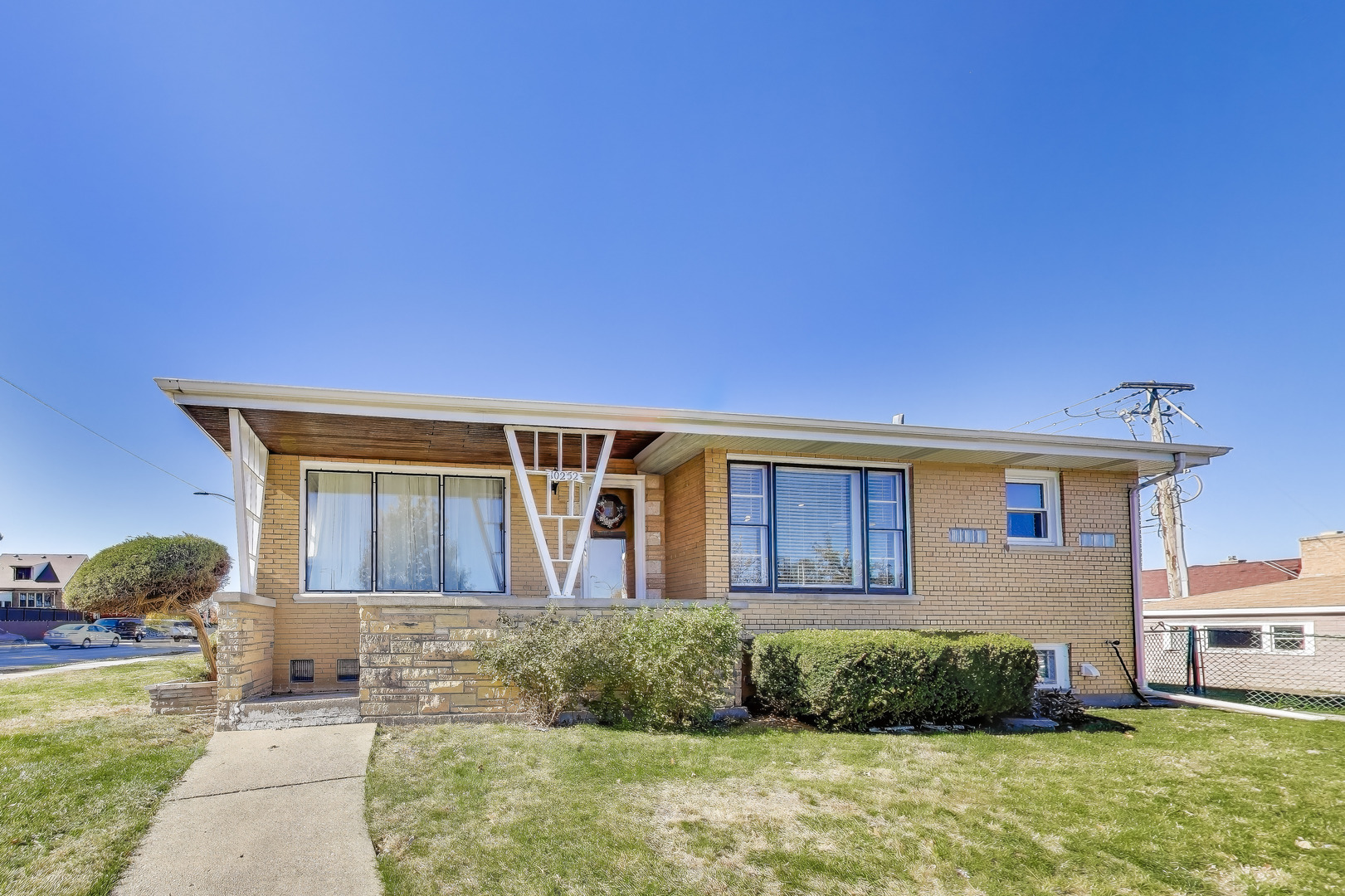 Undisclosed Address Chicago, IL 60655 - Photo 2 of 25 a front view of a house with a yard
